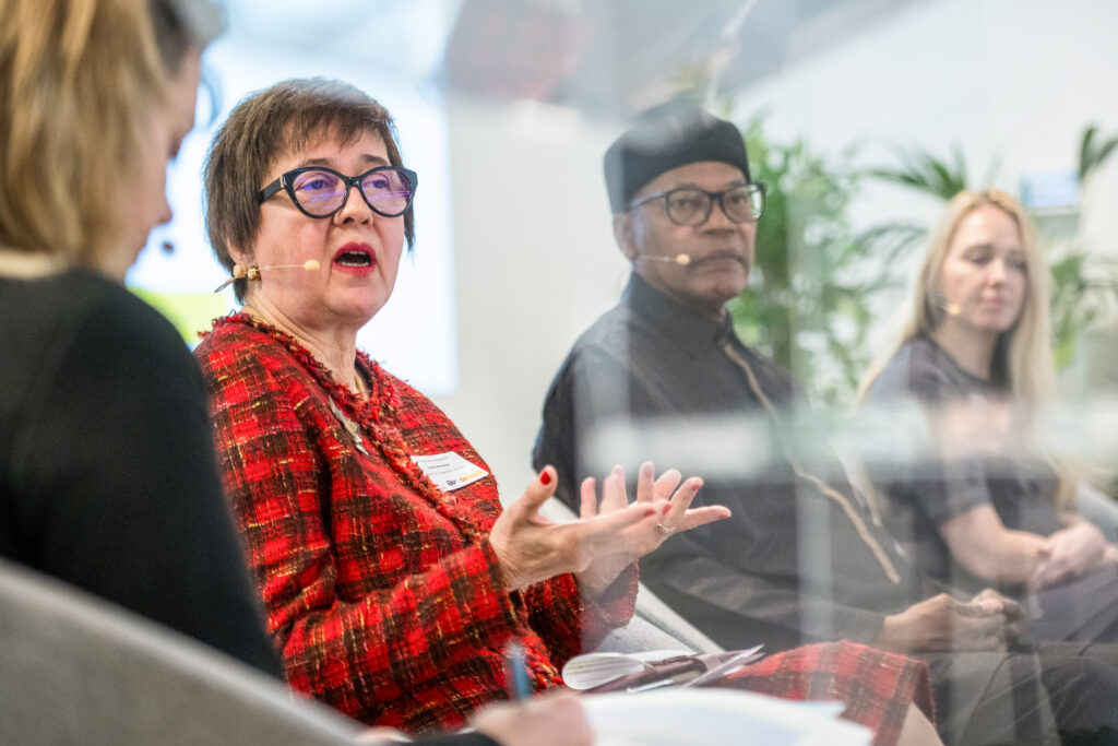 Panelists sitting and discussing the topic at hand