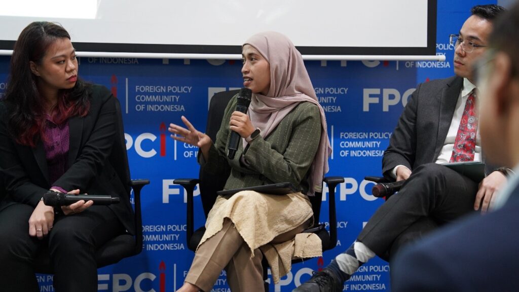 Three people sitting in a panel discussion