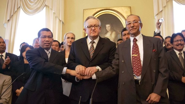 Three people shaking hands