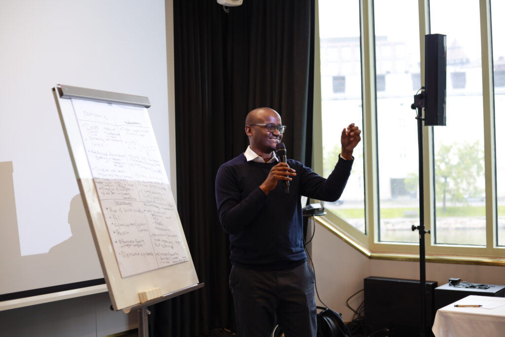 Man speaking at flipchart