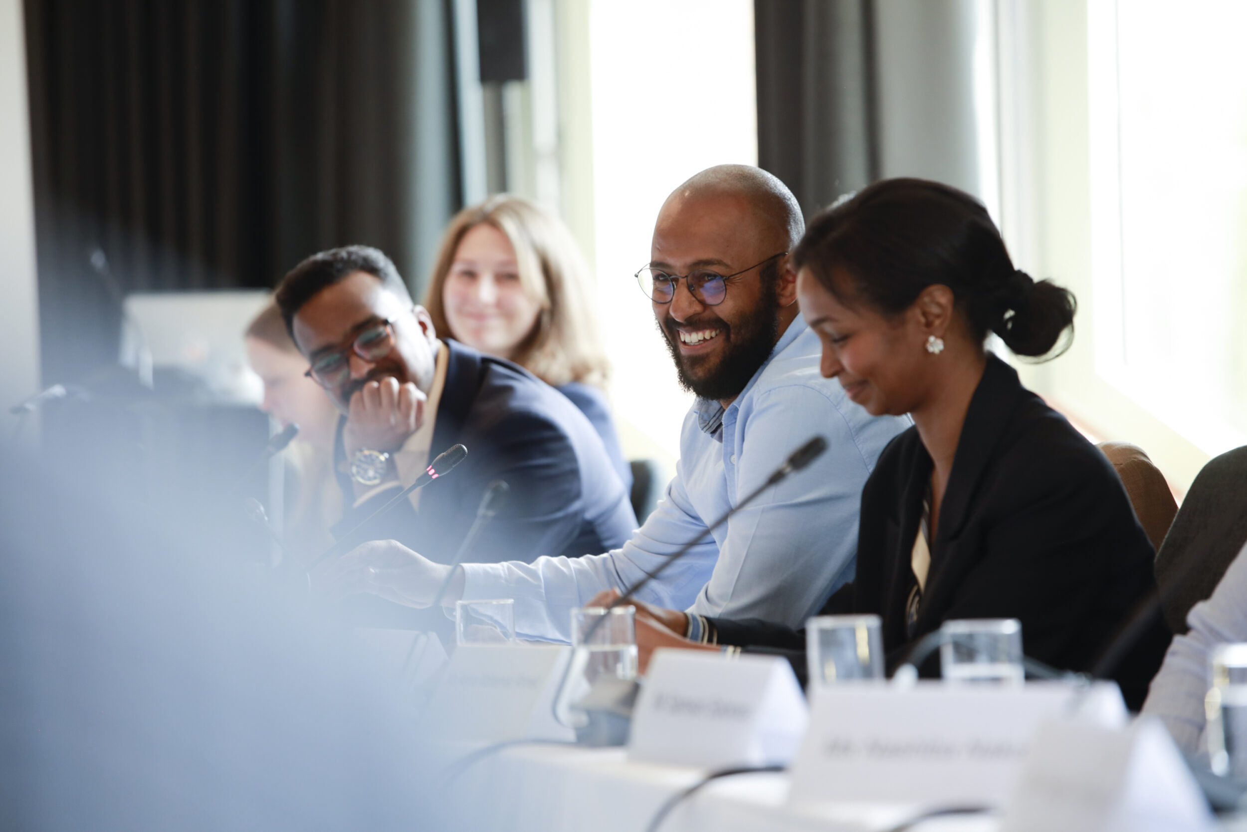 Seated participants smiling