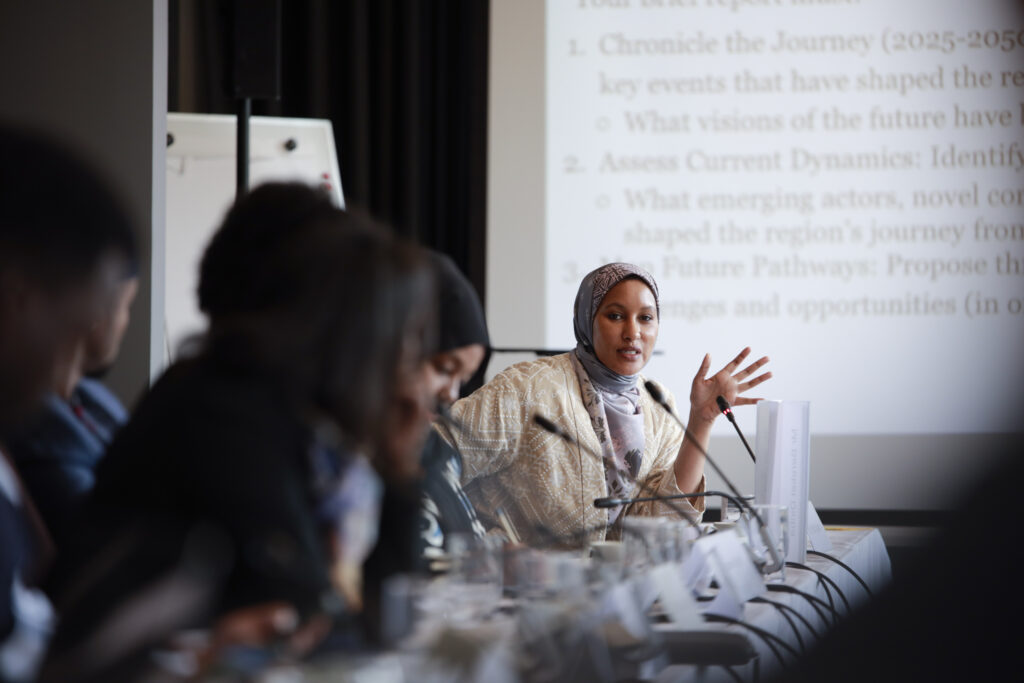 Participants at table talking.