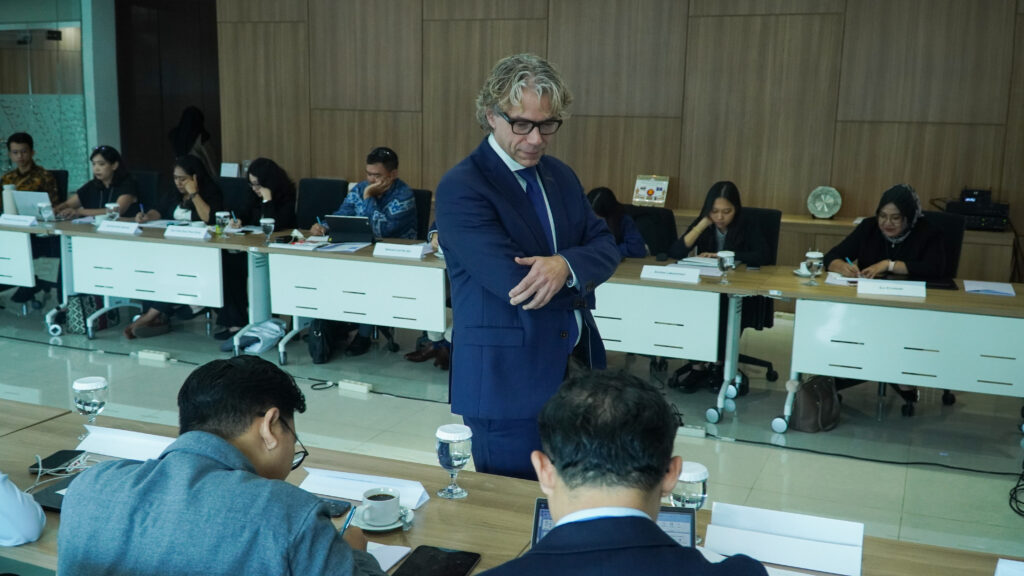 CMI Senior Adviser Wilbur Perlot standing in front of seated participants.