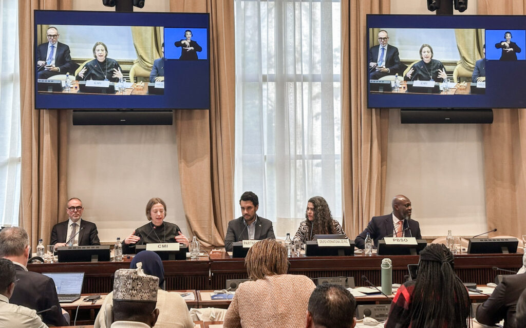 5 participants seated before an audience in the plenary session of the CSO–UN Dialogue