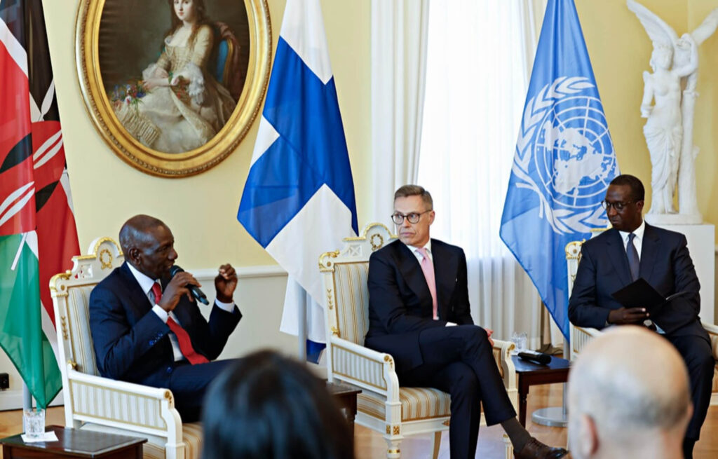 Three men sitting in a panel discussion
