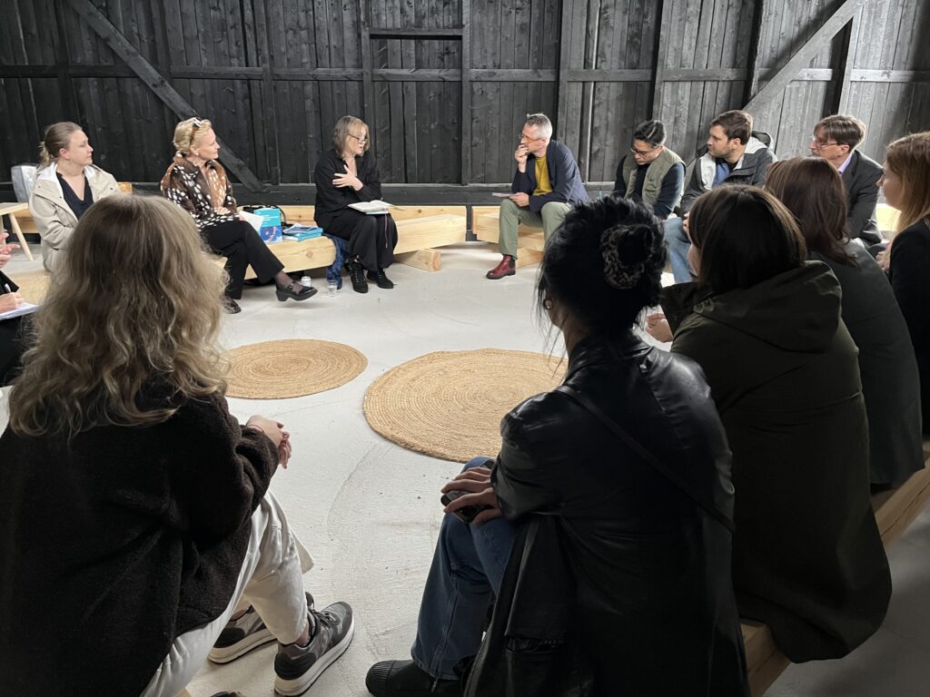 People sitting in circle discussing