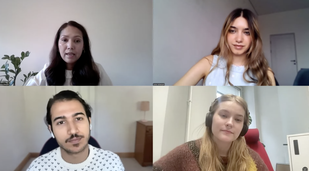 Four people in a meeting
