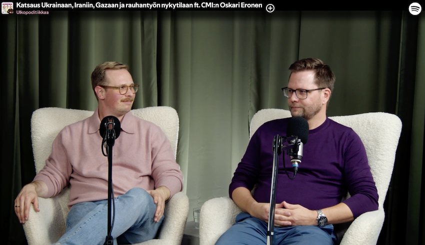 Two men sitting and talking