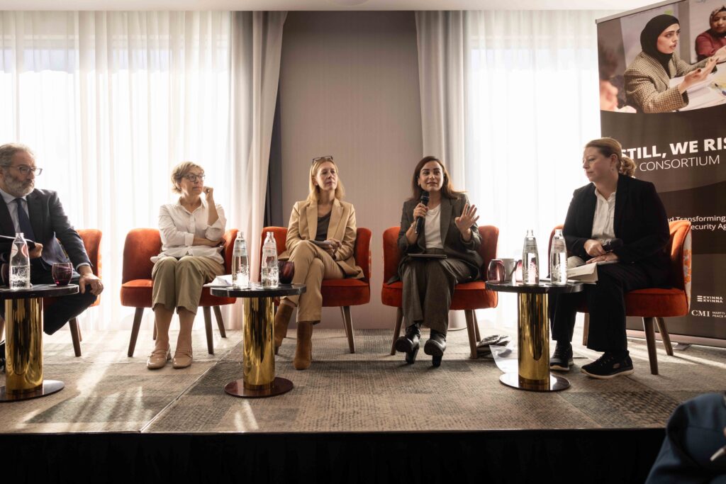 A panel of people sitting and talking